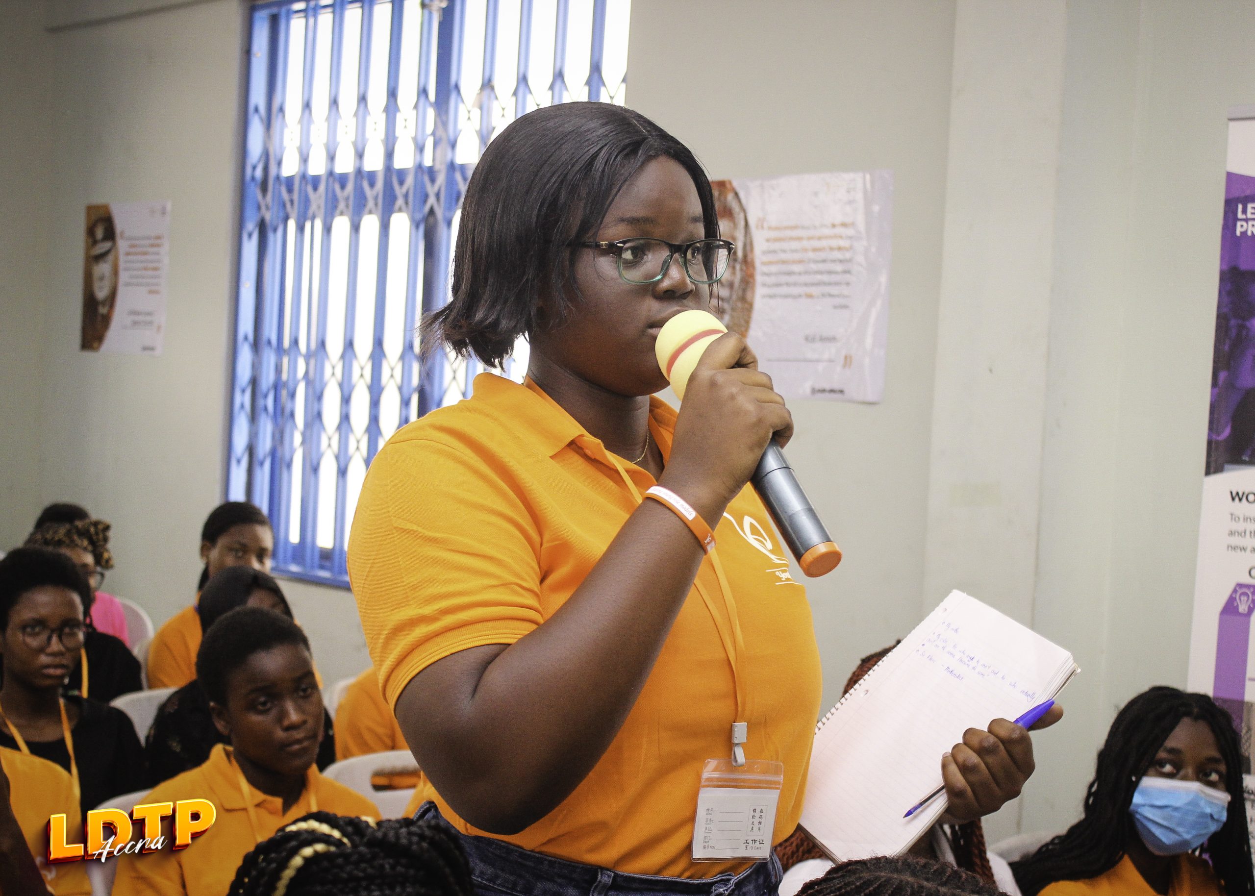 A participant speaking with a microphone during an LDTP session