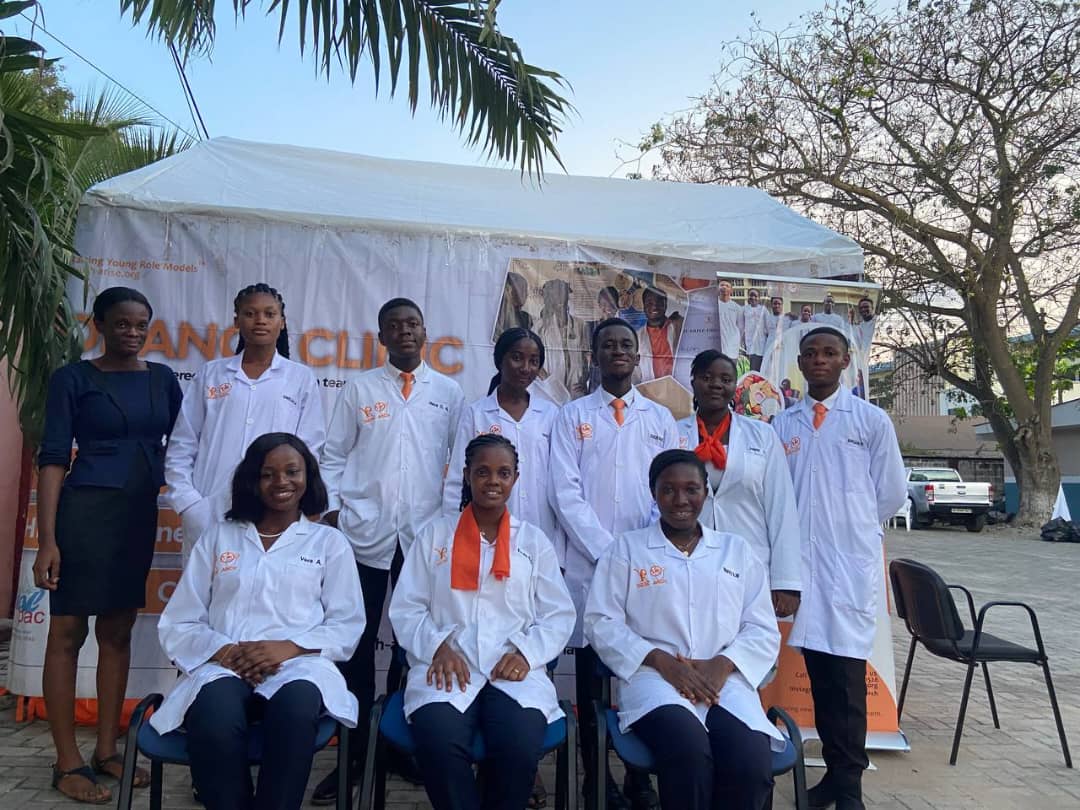 ARCH team members beside their health outreach tent