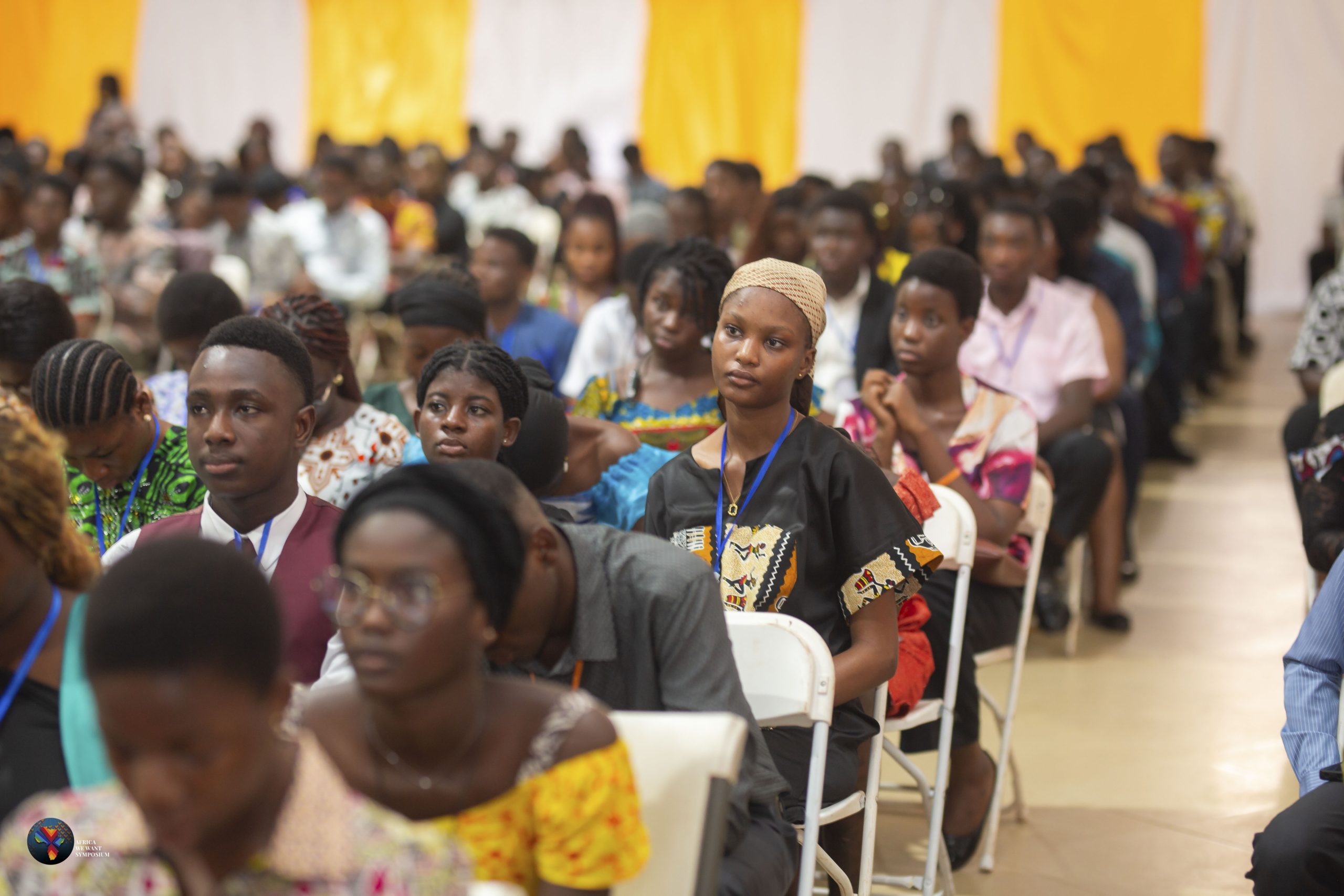 Young African participants listening at a Youth Arise symposium