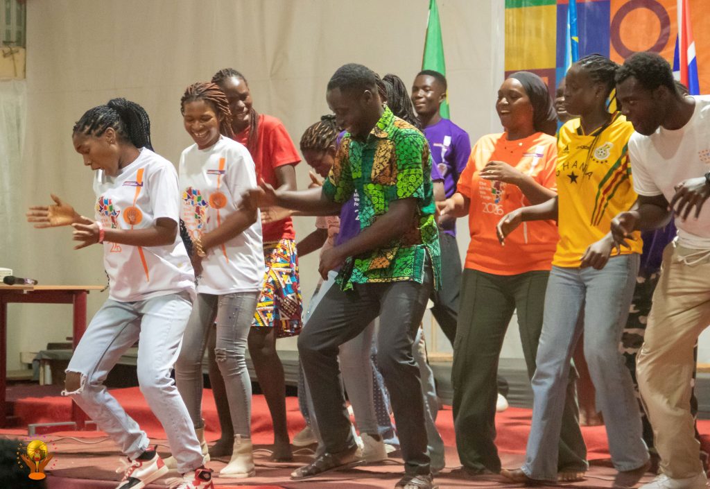 Participants dancing together at the Orange Youth Festival.