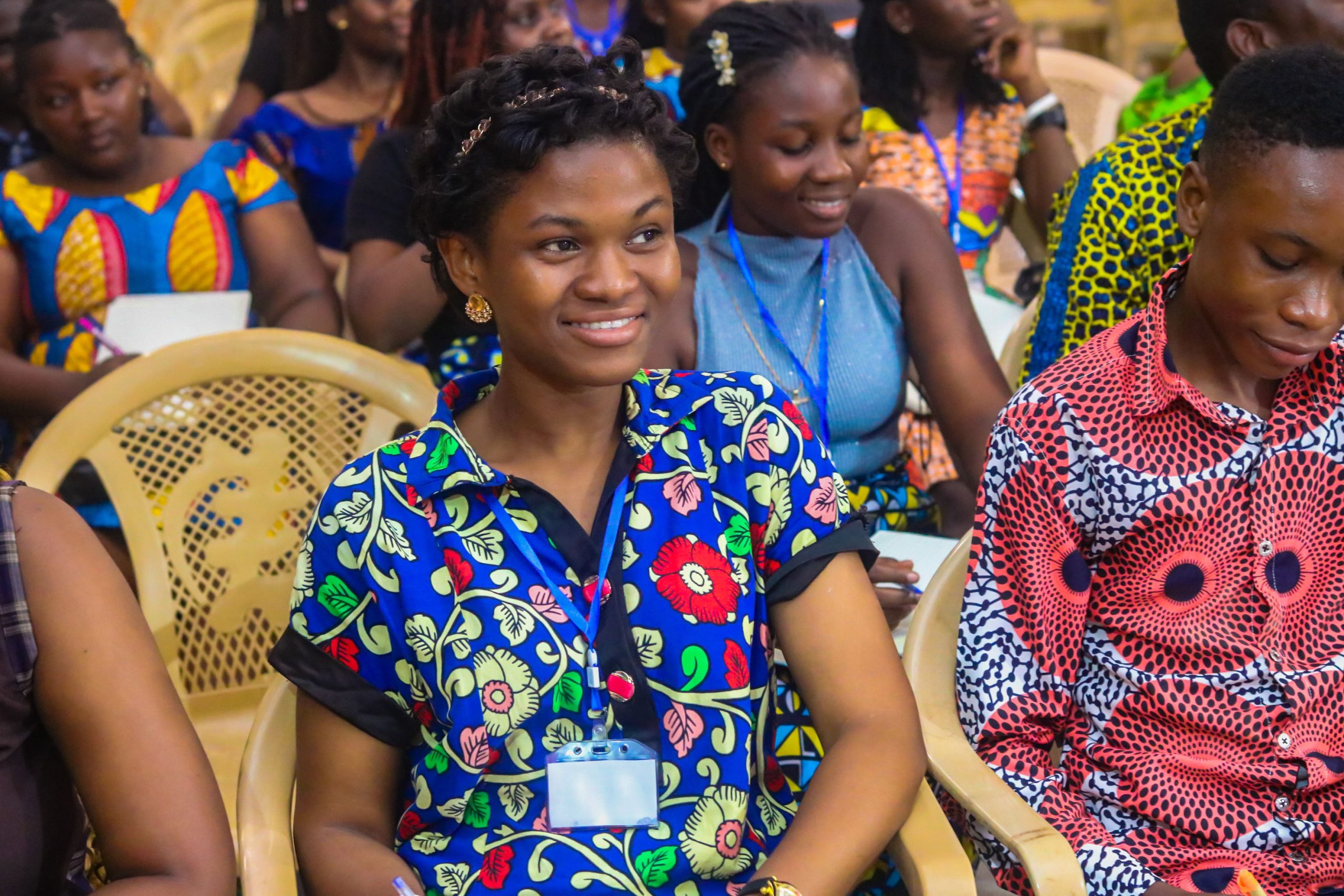 Young participants seated together during the conference