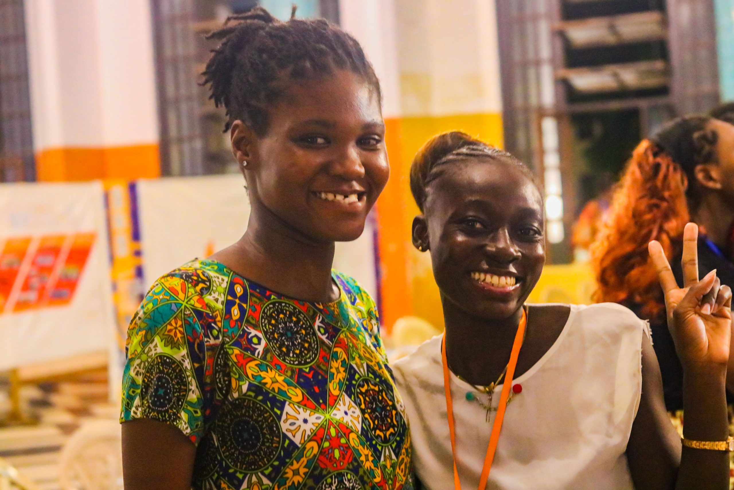 Two smiling conference participants together