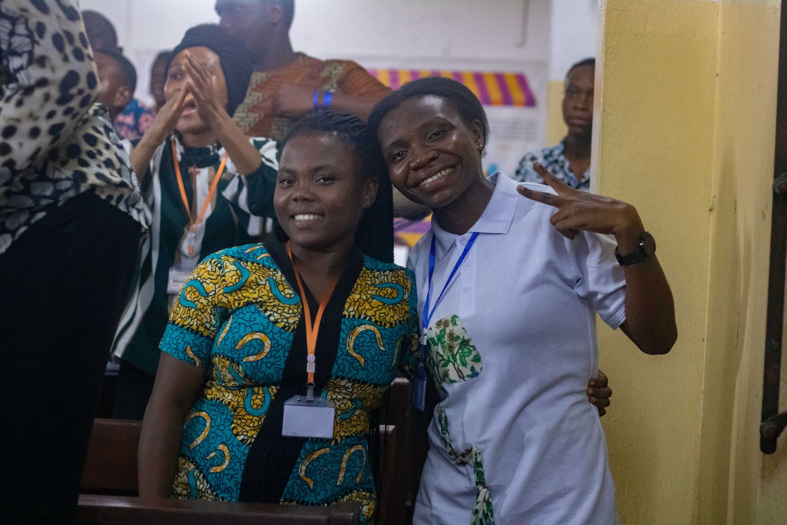 Two young conference participants standing together