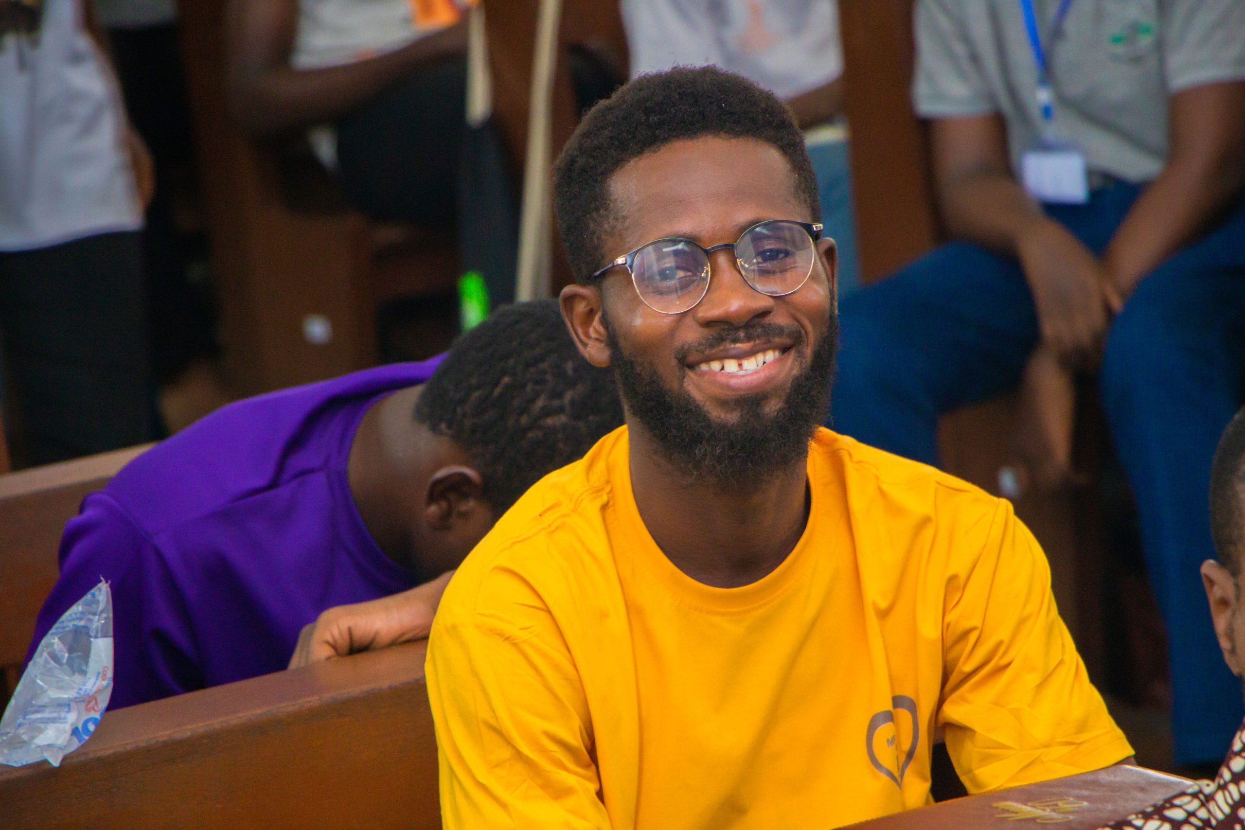 Smiling participant enjoying the conference experience